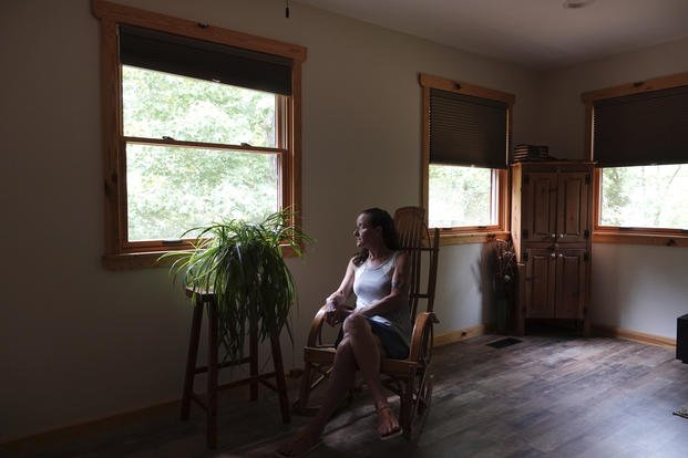 Gretchen Catherwood sits in her home in Springville, Tenn