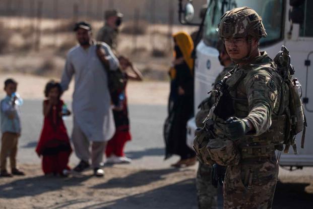 Military police paratroopers receive Afghan evacuees 