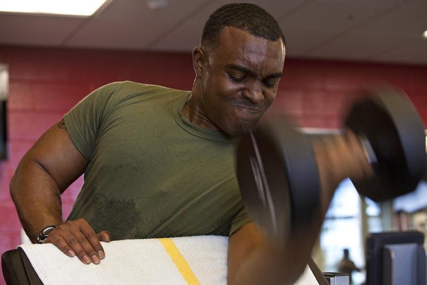 Gunnery sergeant performs a biceps curl.