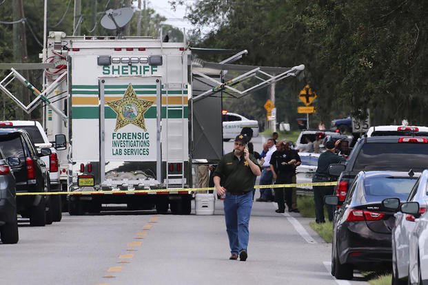Polk County, Fla., Sheriff's officials at a crime scene. 