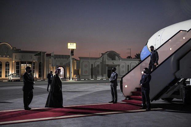 U.S. Secretary of State Antony Blinken, right, arrives at Old Doha Airport