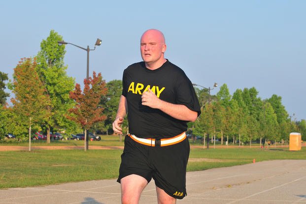 Army reservist runs during physical fitness test.