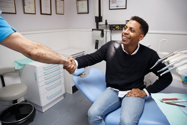 Dominion National man shaking hands with dentist