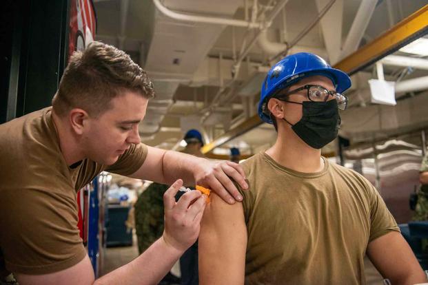 Sailor receives COVID-19 vaccine aboard the USS George Washington