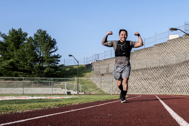 Airman completes a mile run as part of the Murph Challenge.