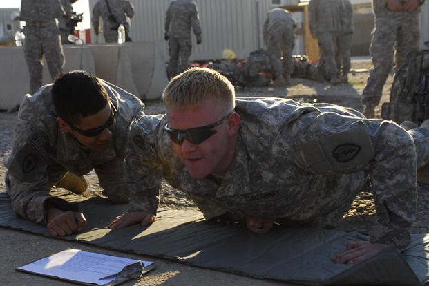 Infantryman performs push-ups during a fitness challenge.