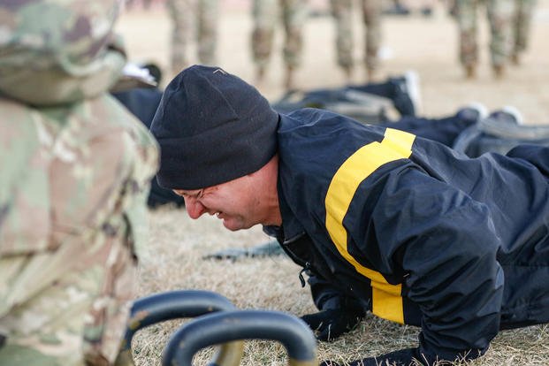 Infantryman performs hand-release push-ups.