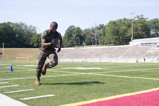 Marine sprints during a 100-yard agility sprint.