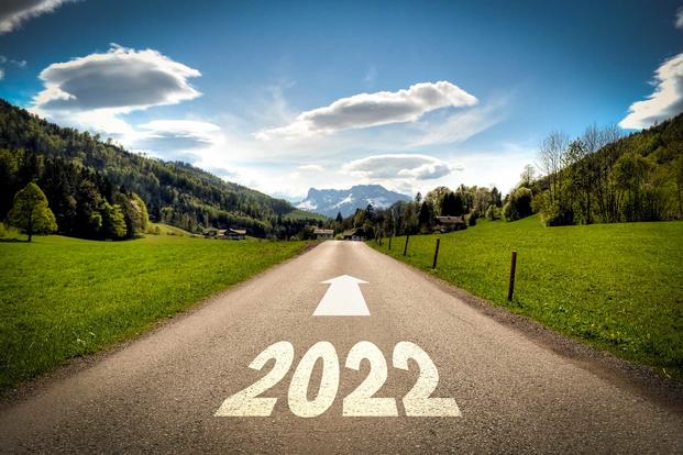 2022 written on highway pavement symbolizing movement down road of time and life