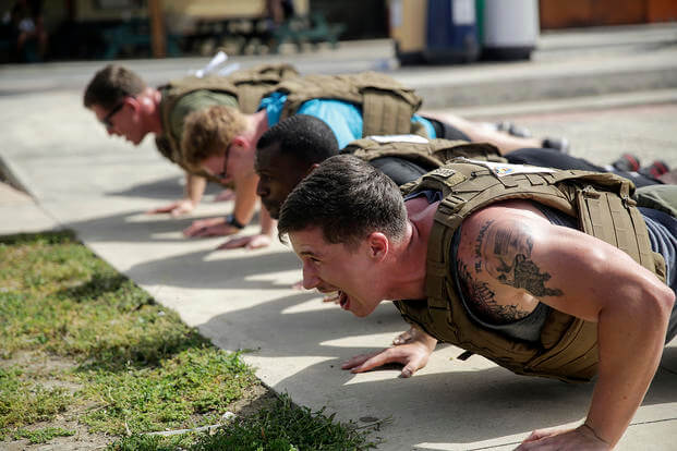 Marines do push-ups during the Memorial Day Murph challenge.