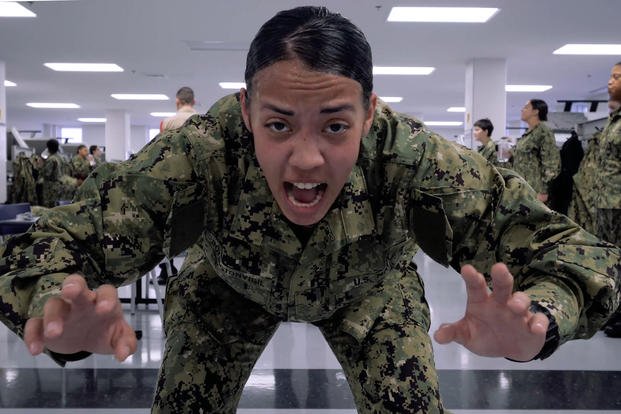 A Navy recruit performs physical exercises during boot camp.