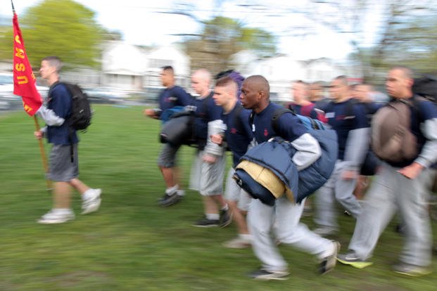 Recent Marine enlistees run to get into platoon formation.