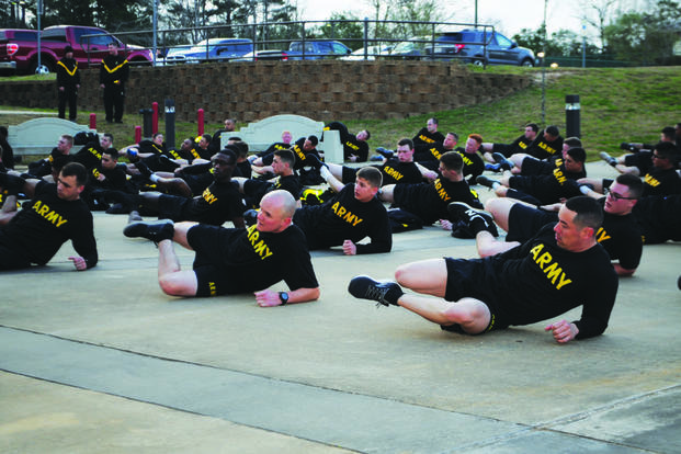 Incoming soldiers stretch out after a run at Fort Polk.