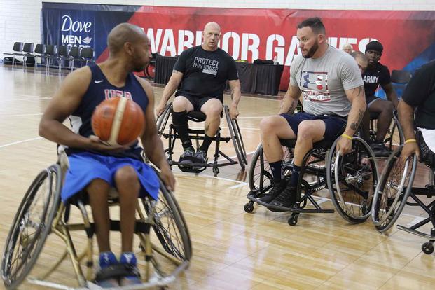 U.S. soldiers and veterans, practice wheelchair basketball