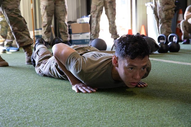A soldier performs a hand-release push-up during the army combat fitness test.