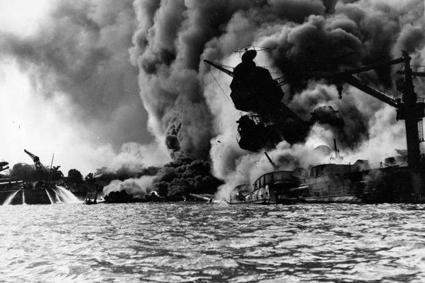 USS Arizona sunk and burning furiously on Dec. 7, 1941. 