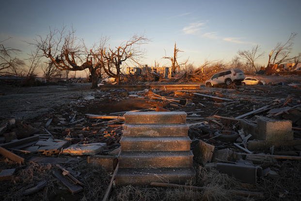 The front steps of a house are all that remains after a tornado in Dawson Springs, Ky.