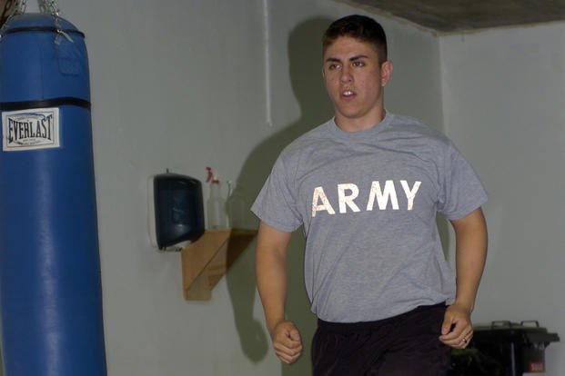 A soldier runs during interval circuit training.