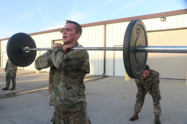 A soldier performs a front squat.
