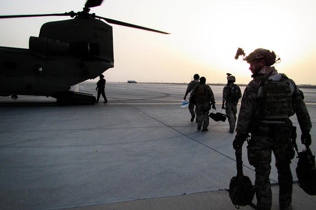 U.S. Special Forces soldiers, attached to Special Operations Task Force-Afghanistan, alongside Afghan agents from the National Interdiction Unit, NIU, load onto CH-47 Chinooks helicopters.