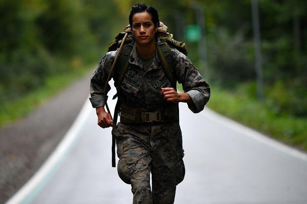 A Marine takes part in a ruck march.