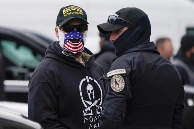 Oath Keepers attend a rally at Freedom Plaza