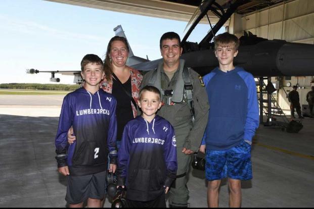 Minnesota Air National Guard Master Sgt. Noah Feehan with his family