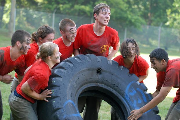 High school students participate in a tire-rolling race during the 2011 U.S. Naval Academy Summer Seminar Sea Trials.