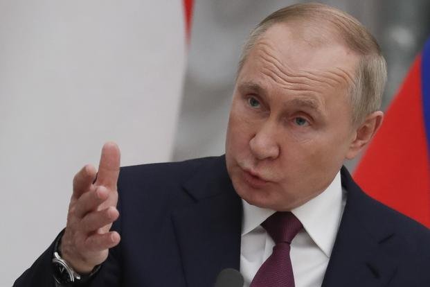 Russian President Vladimir Putin speaks during a news conference in Moscow