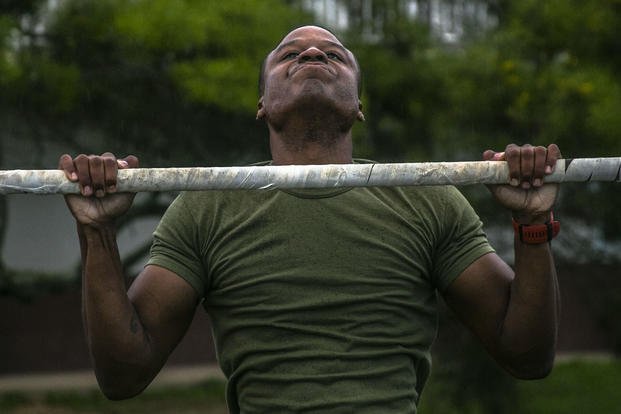 A Marine does pull-ups to celebrate the Marine Corps' birthday.