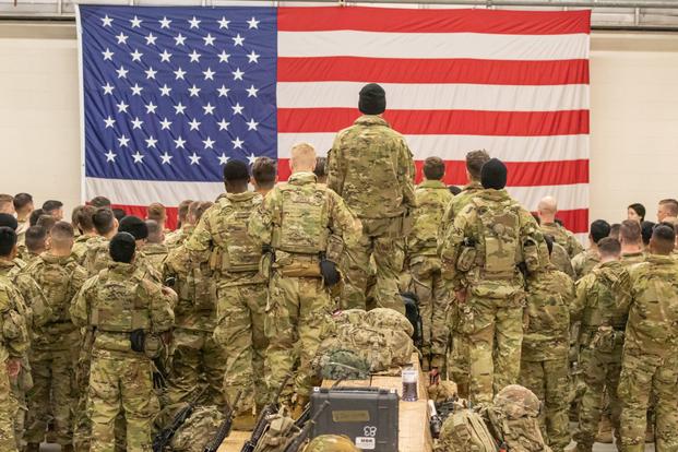 U.S. Army paratroopers gather for a deployment brief at Pope Army Airfield.
