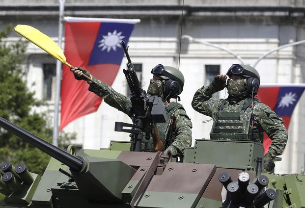 Taiwanese soldiers salute during National Day celebrations in Taipei.