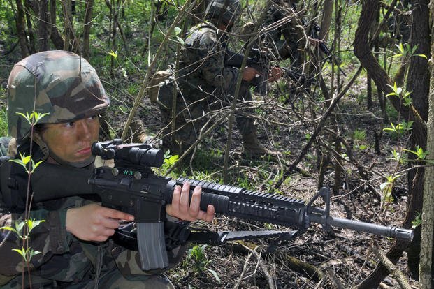 A Navy ROTC midshipman fourth class is on patrol during a field training exercise.