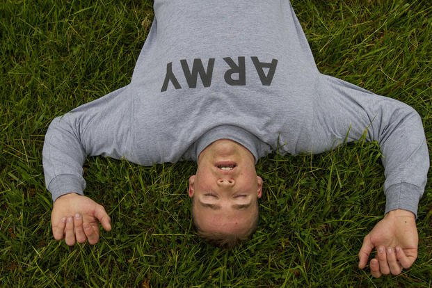 A U.S. Army Reserve military policeman recovers from a two-mile run during a physical fitness test.