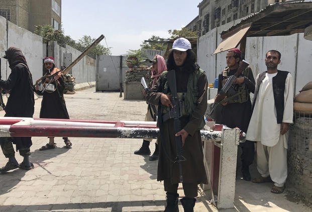 Taliban fighters at a checkpoint near the U.S embassy that was previously manned by American troops