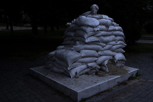 sculpture of Dante Alighieri, is protected by sandbags, on Vladimir's Hill in Kyiv, Ukraine