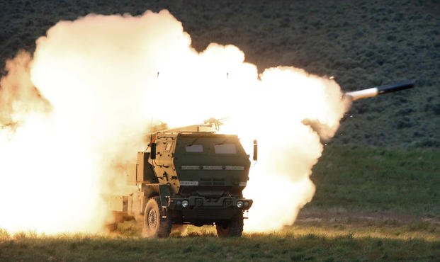 Launch truck fires the High Mobility Artillery Rocket System.