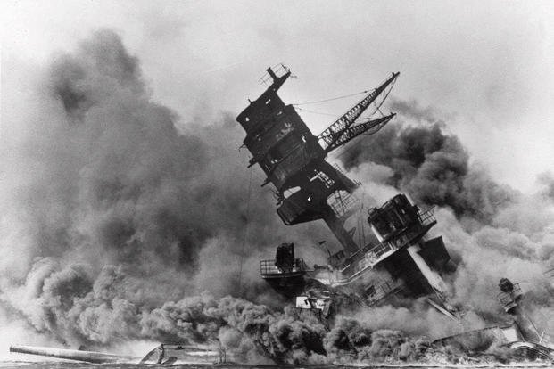 Smoke rises from the USS Arizona as it sinks during the Japanese attack on Pearl Harbor.