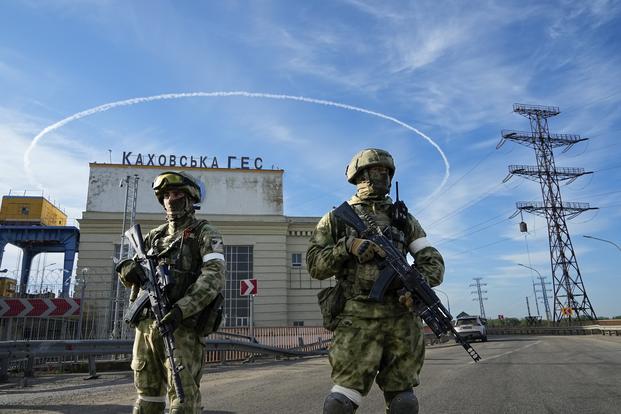 Russian troops guard Kakhovka Hydroelectric Station in south Ukraine.