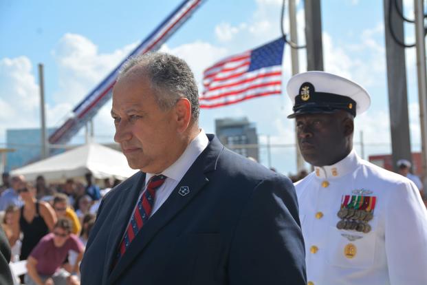 Secretary of the Navy Carlos Del Toro stands at the commissioning of USS Fort Lauderdale.