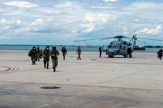 Helicopter Sea Combat Squadron 11 returns to Norfolk Naval Station.