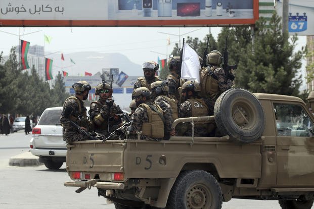 Taliban special force fighters arrive inside the Hamid Karzai International Airport