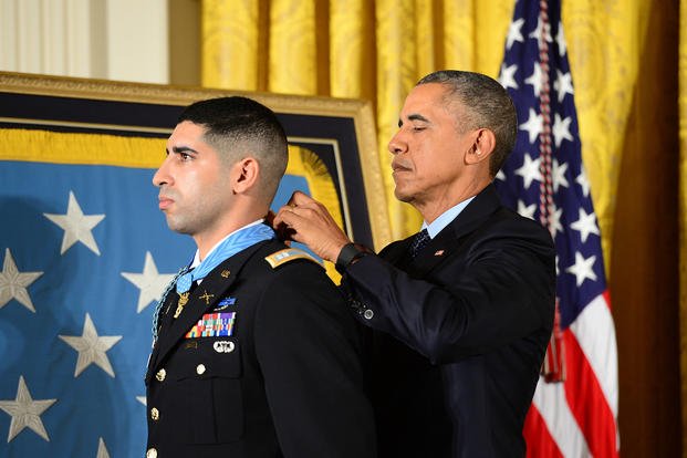 President Barack Obama presents the Medal of Honor to retired U.S. Army Capt. Florent Groberg during a ceremony at the White House in Washington.
