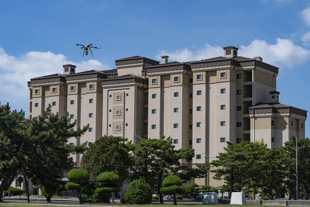 An 8th Civil Engineer Squadron Small Unmanned Aircraft System prepares to land after surveying the rooftop of a dorm building at Kunsan Air Base, Republic of Korea.