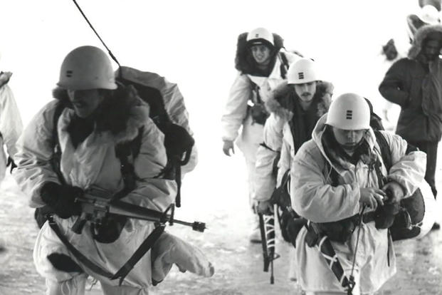 U.S. Army troops board a plane at Elmendorf Air Force Base in 1975 for an Arctic Warrior exercise