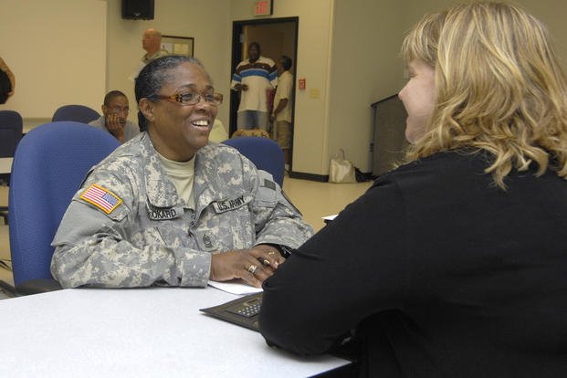 Master Sgt. Barbara Bookard, ASA-Dix Mobile Readiness Battalion, reviews her resume and gets interview tips from Kim Keefe, of New York based Achieve It Inc during a job fair at Fort Dix, New Jersey.