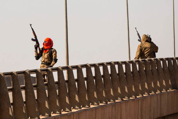 mutinous soldier fires into the air at the Bobo interchange, near the Lamizana camp in Burkina Faso's capital Ouagadougou