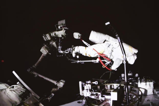  Chinese astronaut Cai Xuzhe conducting extravehicular activities, also known as a spacewalk