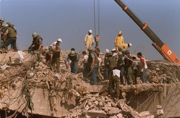 Rescue workers sift through U.S. Marine base in Beirut in Oct. 23, 1983.