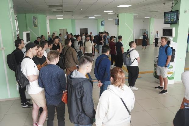 Russians lineup to get Kazakhstan's Personal Identification Number (INN) in a public service center